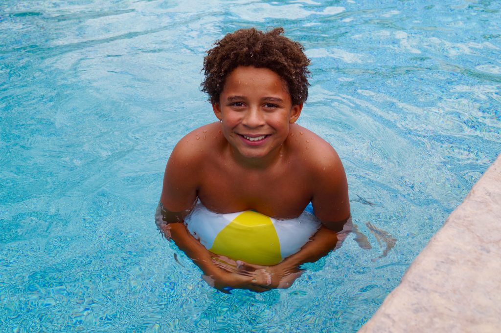 Kid Playing in Pool